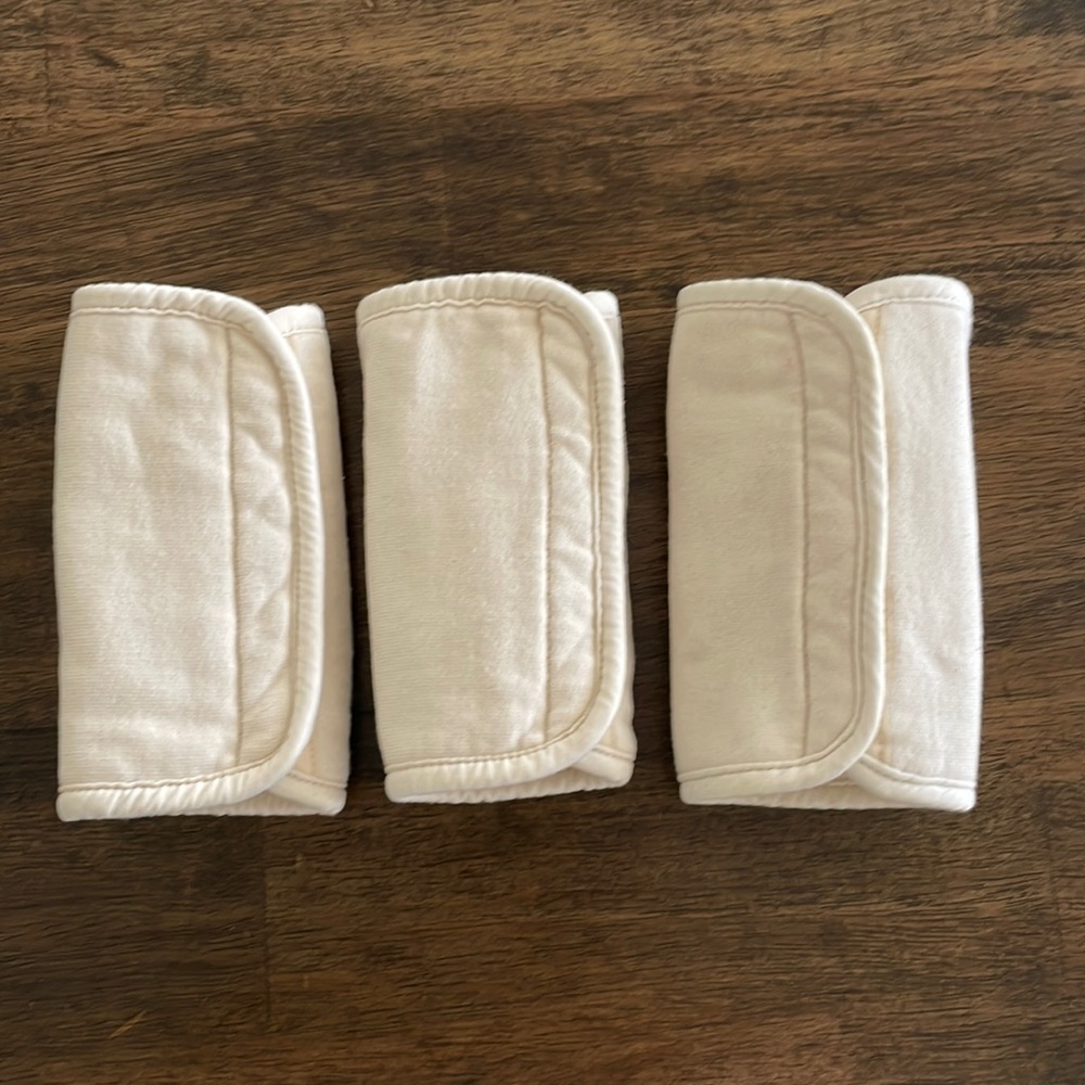 Three organic ErgoBaby strap covers/drool pads.